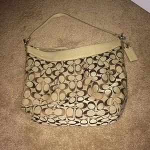 Tan coach bag with lavender inside